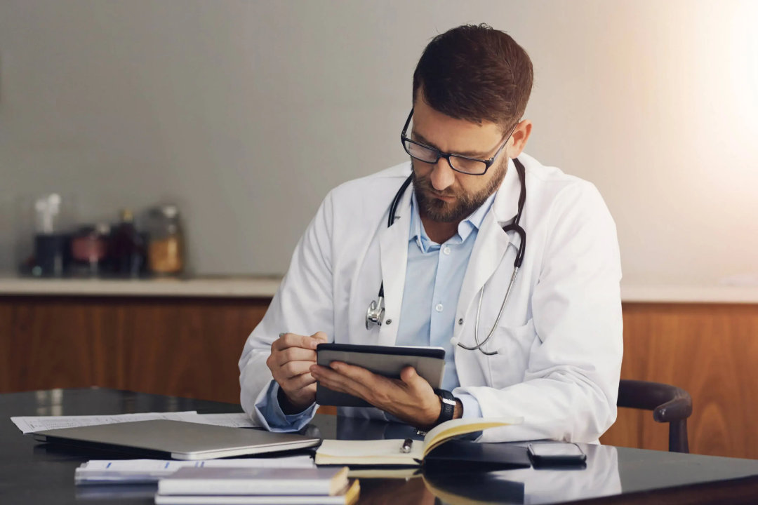 Doctor reviewing business plans for a new Direct Primary Care practice