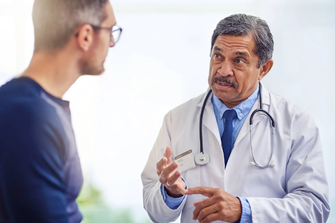 Doctor explaining the Direct Primary Care membership model to a patient