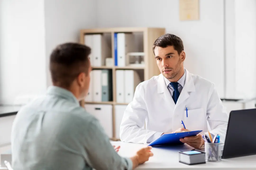 Primary care physician coordinating care with a patient