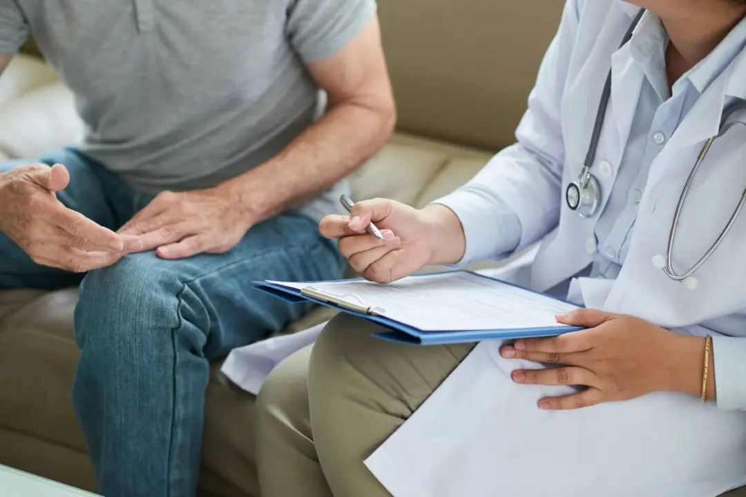 Healthcare provider reviewing a shared-savings contract with a patient