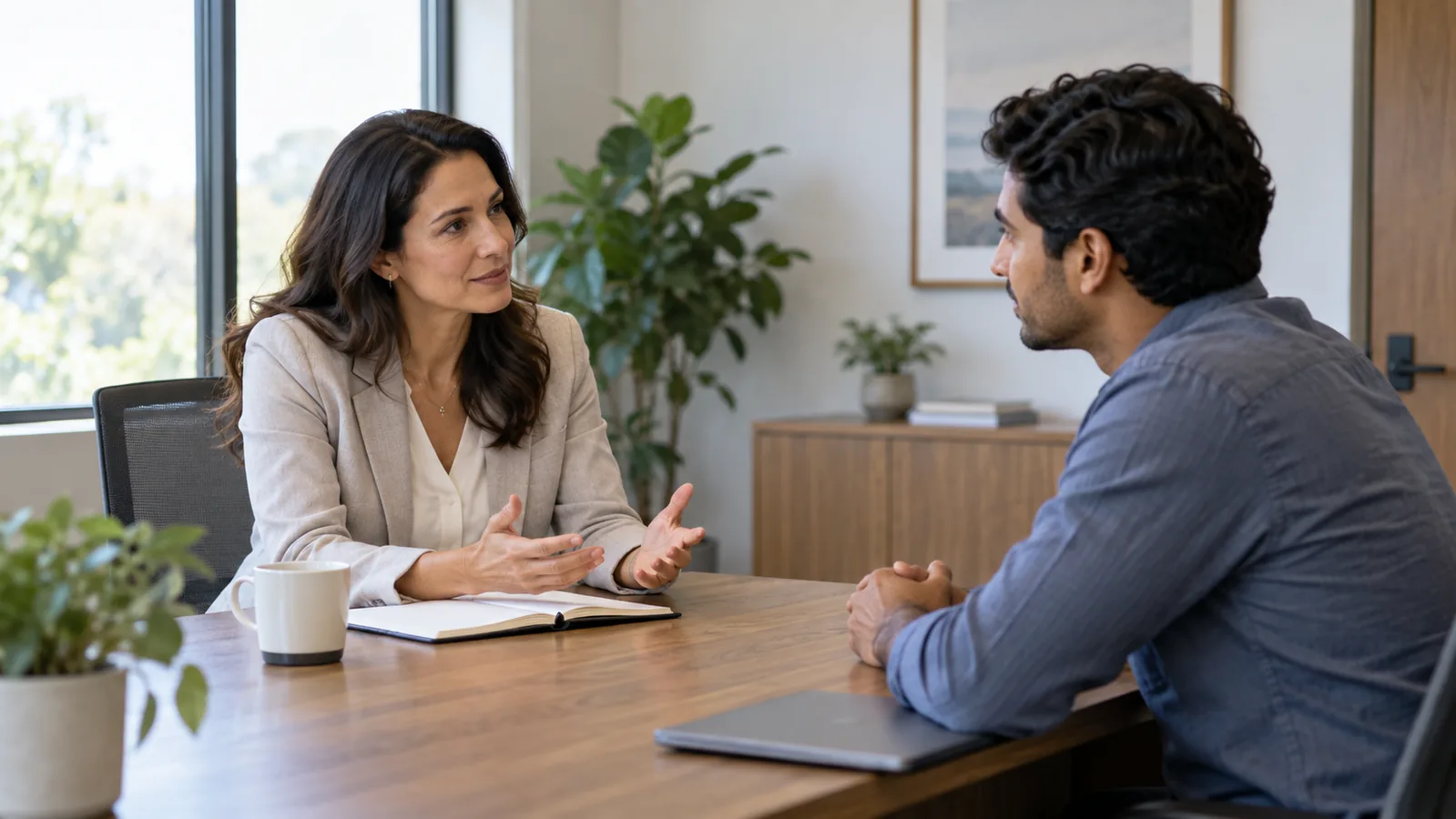 Manager having a supportive private conversation with an employee